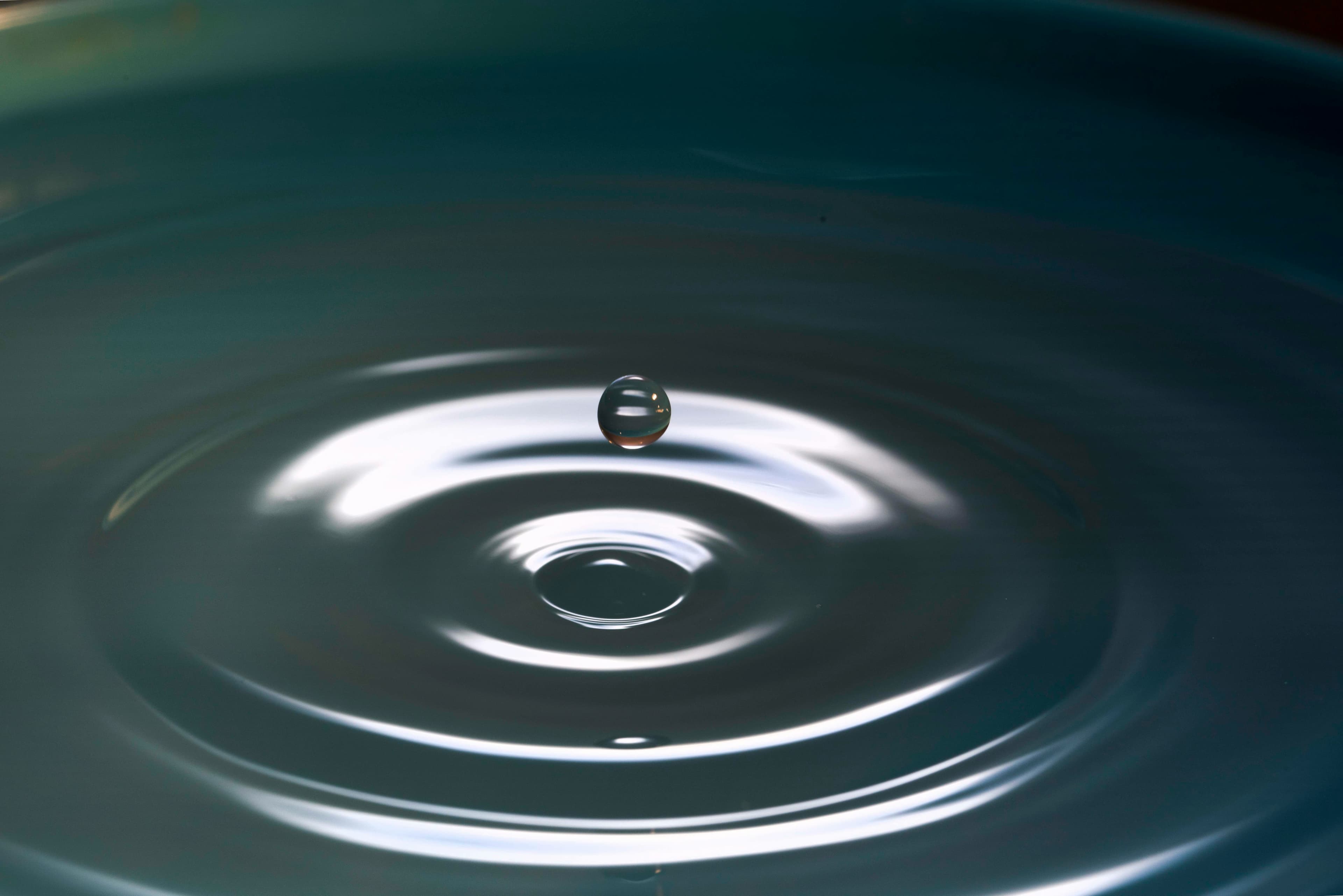 A water droplet rippling — cellular hydration and replenishment