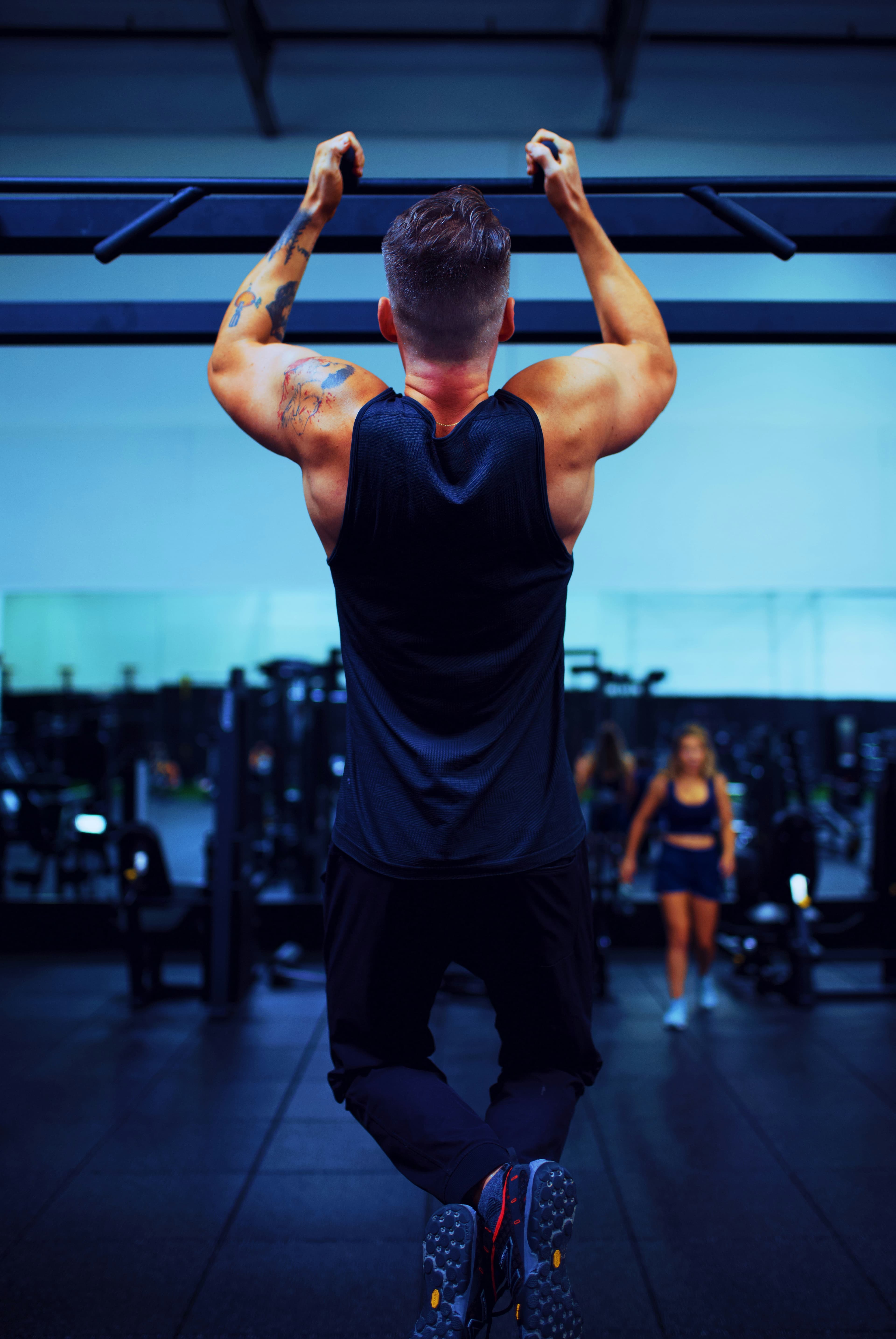 A man training on a pull-up bar — strength and circulation as the foundation of men's health